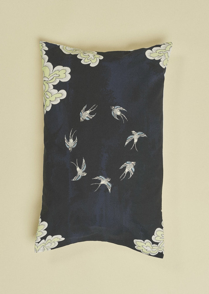 Blue organic cotton pillowcase featuring a ring of hand illustrated swifts.