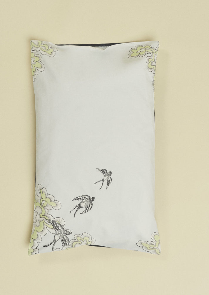 Hand illustrated pale blue pillow slip featuring swifts.