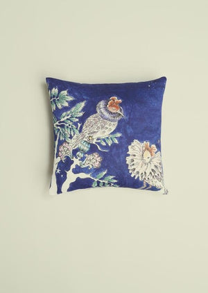 An organic cotton square blue cushion featuring two hand illustrated ruff birds.